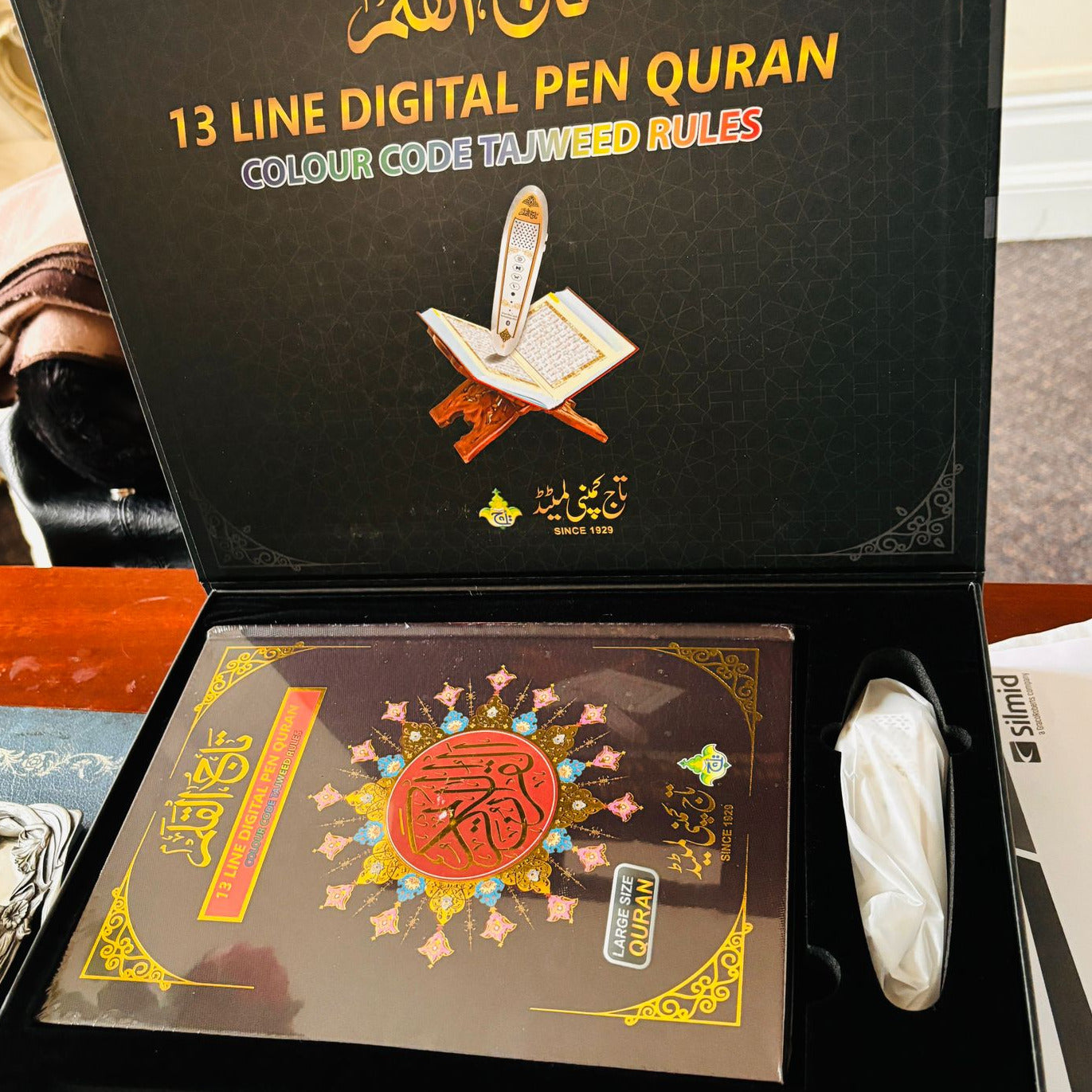 13 Line Digital Pen Quran packaging with visible text and design elements.