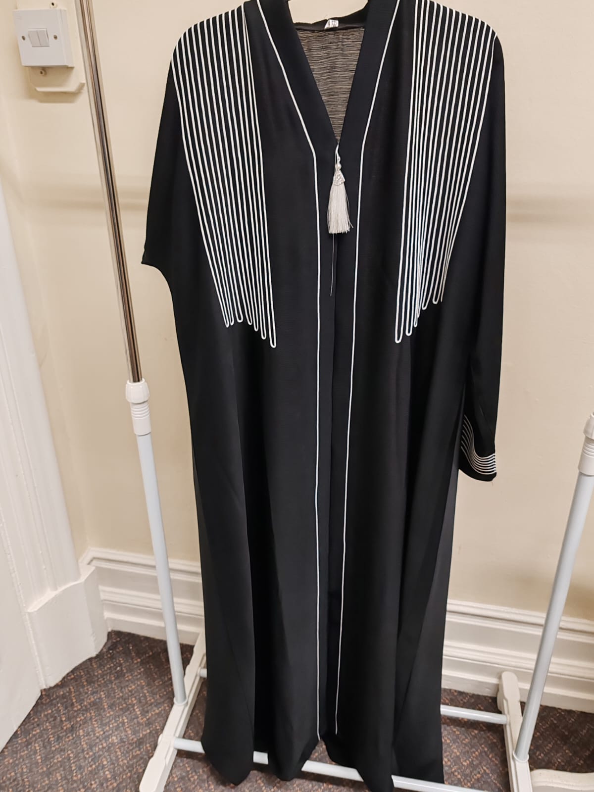Modern Black Abaya with White Embroidery & Tassel Accent – Elegant Open