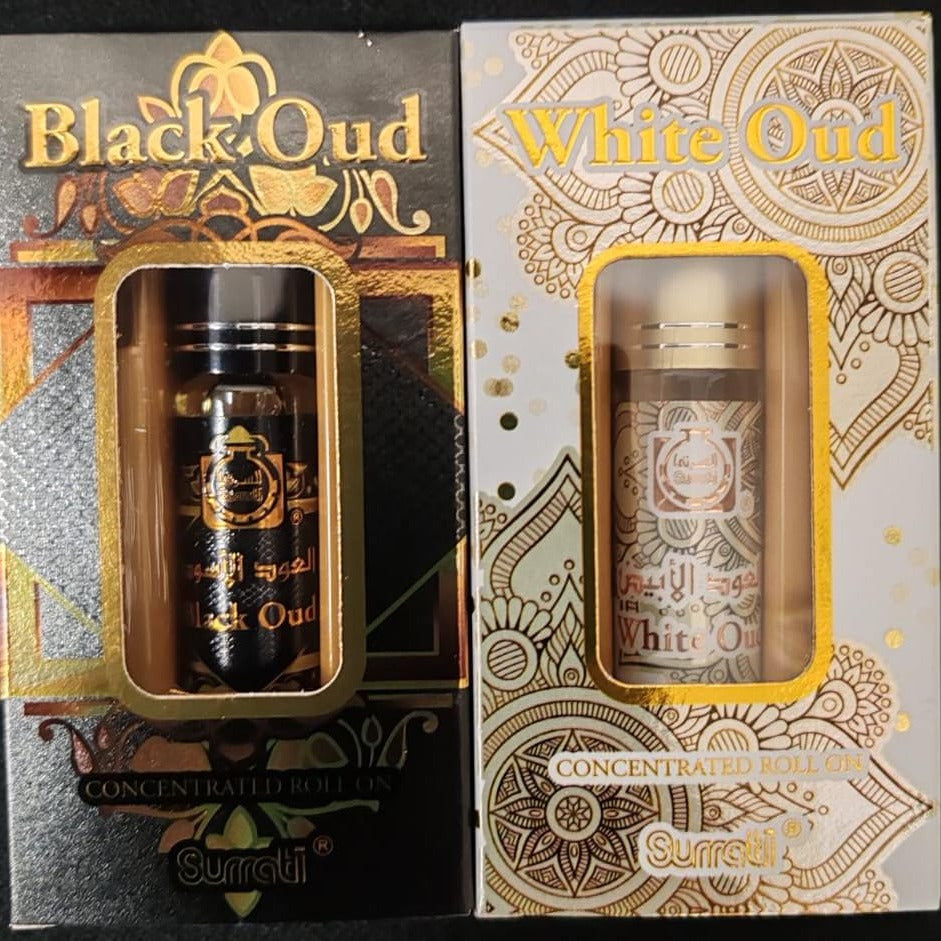 Two boxes of Black Oud and White Oud concentrated oils with decorative packaging.